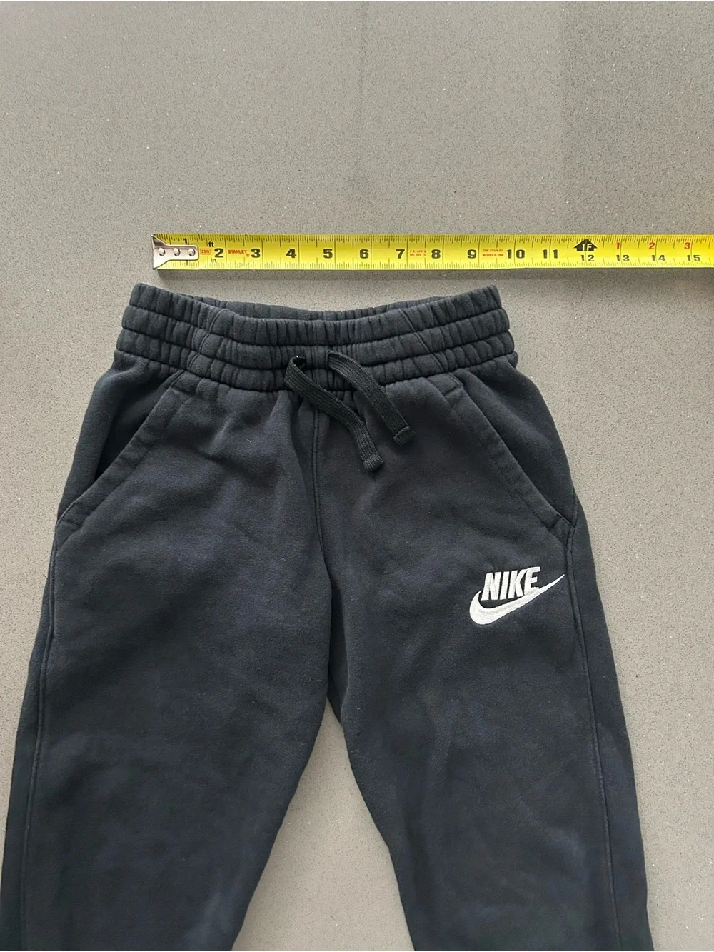 Nike Black Kids Fleece Joggers with White Logo size Small.